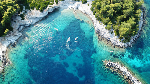 Fototapeta Naklejka Na Ścianę i Meble -  Aerial drone bird's eye view photo of iconic small safe port of Gaios with traditional Ionian architecture and sail boats docked, Paxos island, Ionian, Greece