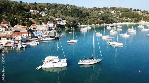 Aerial drone bird s eye view photo of iconic small port and fishing village of Lakka with traditional Ionian architecture and sail boats docked  Paxos island  Ionian  Greece