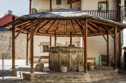 View of an Ablution Fountain for Islamic Prayers in a Mosque Backyard photo