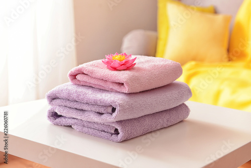Stack of clean towels on table