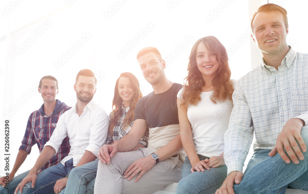 Obraz premium young creative people sitting on chairs in waiting room