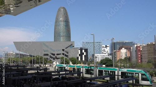 Barcelona urban landscape with the tram and Central Business Area buildings in the background, Barcelona, Spain