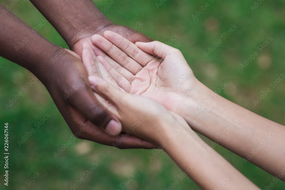 Man and woman hands held together gesturing they need help Man and woman hands held together gesturing they need help
