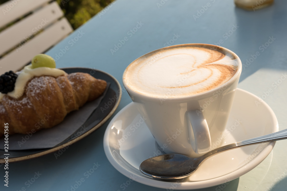 Breakfast at the beach with pasta and capuccino Breakfast at the beach with pasta and capuccino