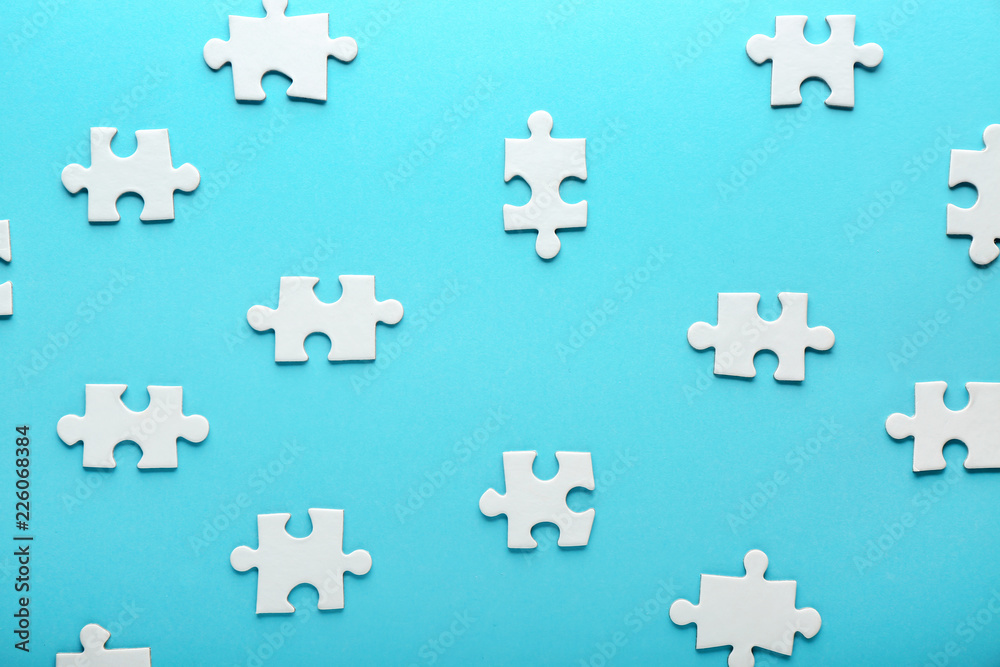 Pieces of jigsaw puzzle on color background Pieces of jigsaw puzzle on color background