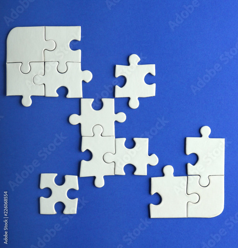 Incomplete jigsaw puzzle on color background