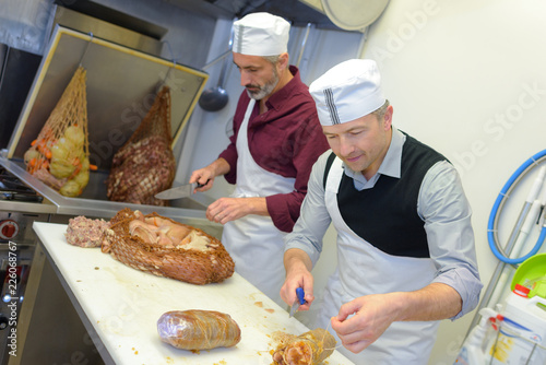 cutting the cooked meat photo