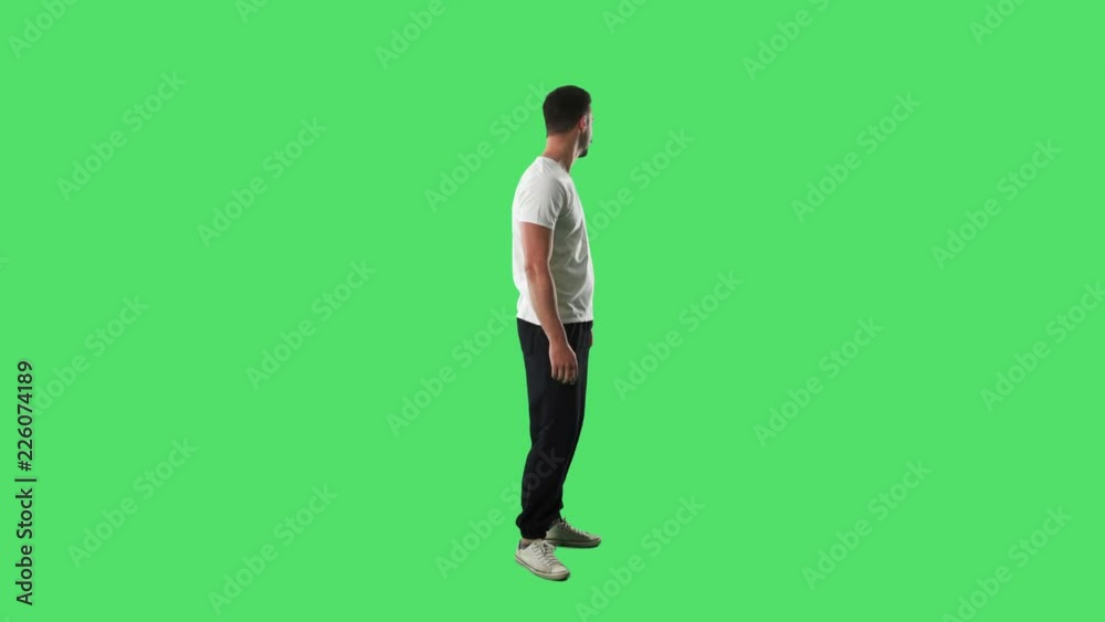 Young handsome sporty fit man shaking head with rejection hand wave gesture. Full body isolated on green screen background. Young handsome sporty fit man shaking head with rejection hand wave gesture. Full body isolated on green screen background.