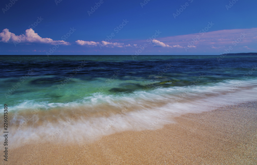 Beautiful summer landscape with sea waves on the beach