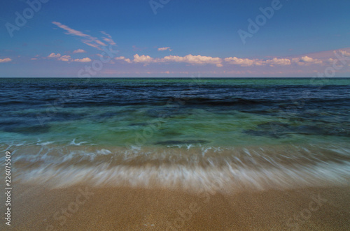 Fototapeta Naklejka Na Ścianę i Meble -  Beautiful summer landscape with sea waves on the beach