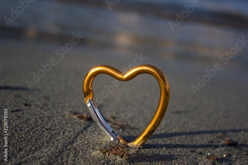 heart on sand by the sea