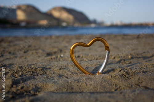 heart on sand by the sea