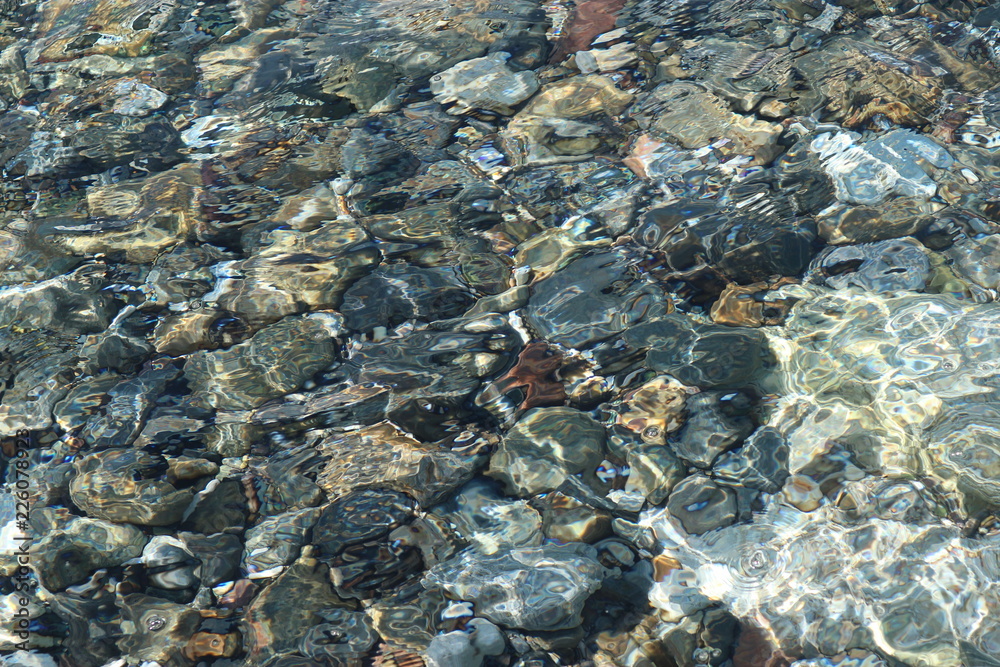 Stones in the clear water of the Mediterranean sea Stones in the clear water of the Mediterranean sea