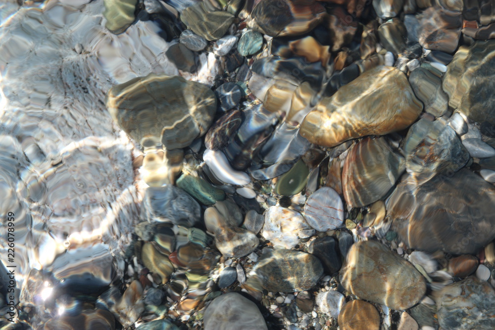 Stones in the clear water of the Mediterranean sea near Monemvasia, Greece
