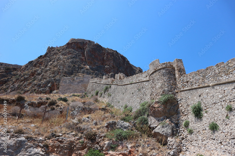 View of the walls of old medieval town of Monemvasia, Peloponnese, Greece