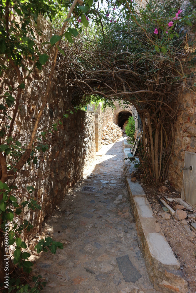 Old narrow street in medieval city of Monemvasia, Peloponnese, Greece