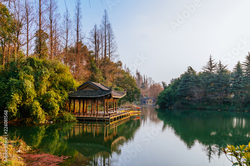 Traditional Chinese pavilion by water near West Lake in Hangzhou, China