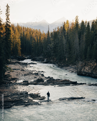 Mountain landscape with man over river