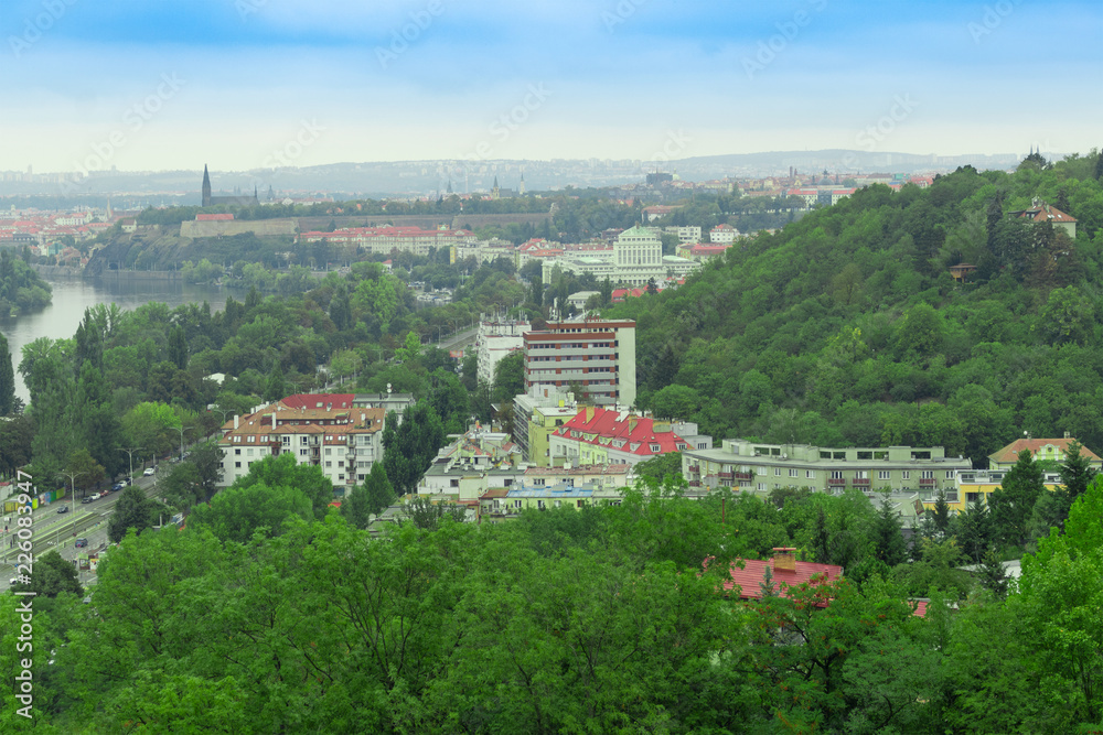 European city on the background of green forest
