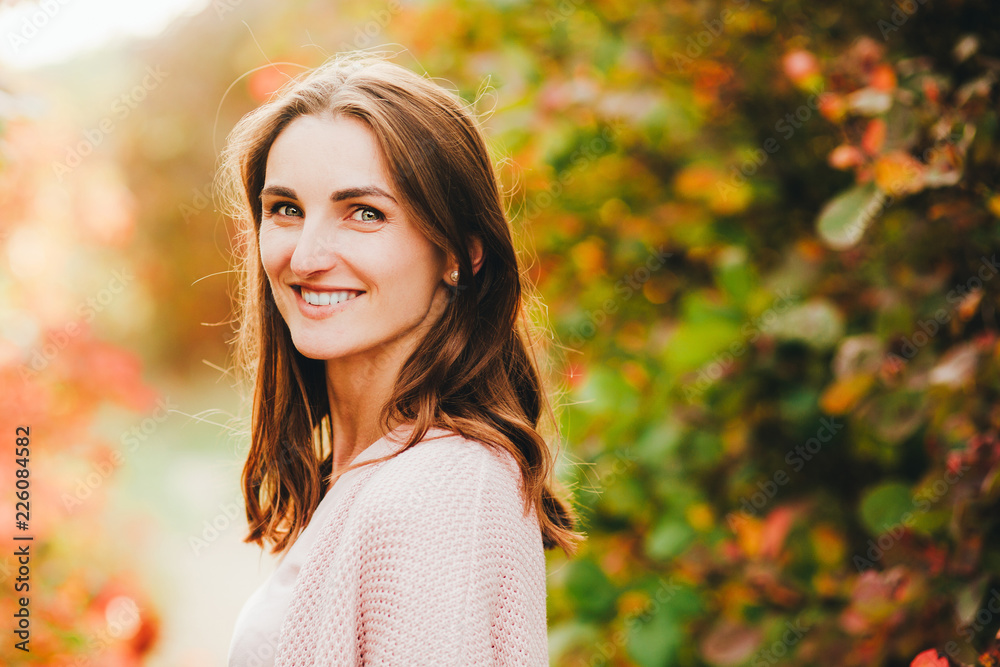 Outdoor atmospheric lifestyle photo of young beautiful lady. Brown hair and eyes. autumn, portrait Outdoor atmospheric lifestyle photo of young beautiful lady. Brown hair and eyes. autumn, portrait