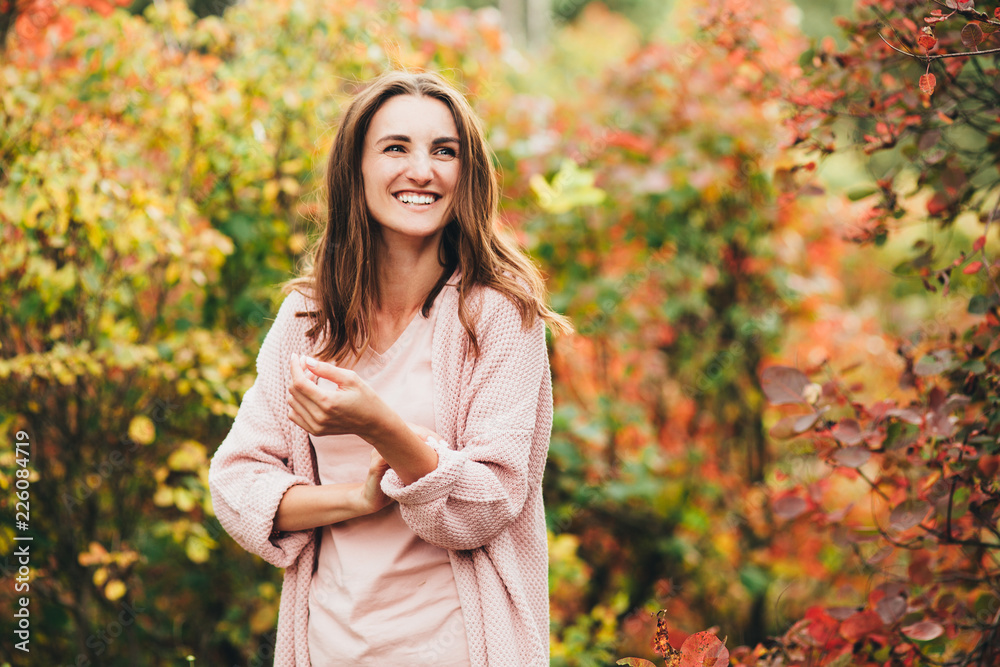 Outdoor atmospheric lifestyle photo of young beautiful lady. Brown hair and eyes. autumn, portrait