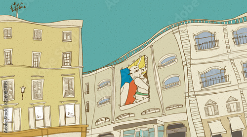 Billboard in building by balconies against sky