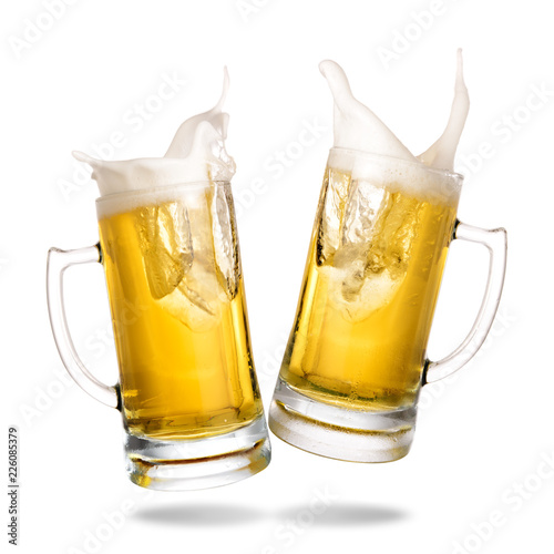 Cheers cold beer with splash out of mug isolated on white background.