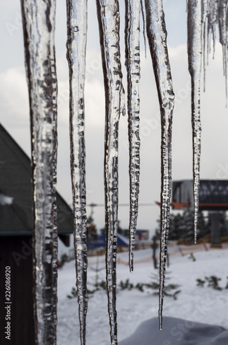 icicles on the roof of the cottage - snow centre