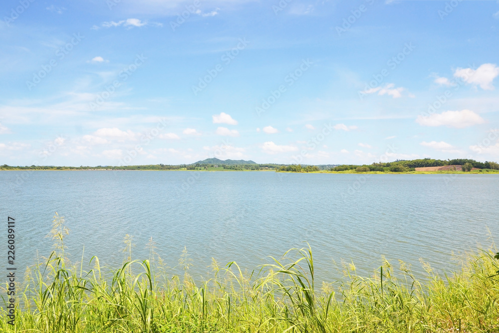 reservoir with mountain and blue sky