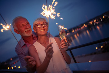 Senior couple having party on terrace
