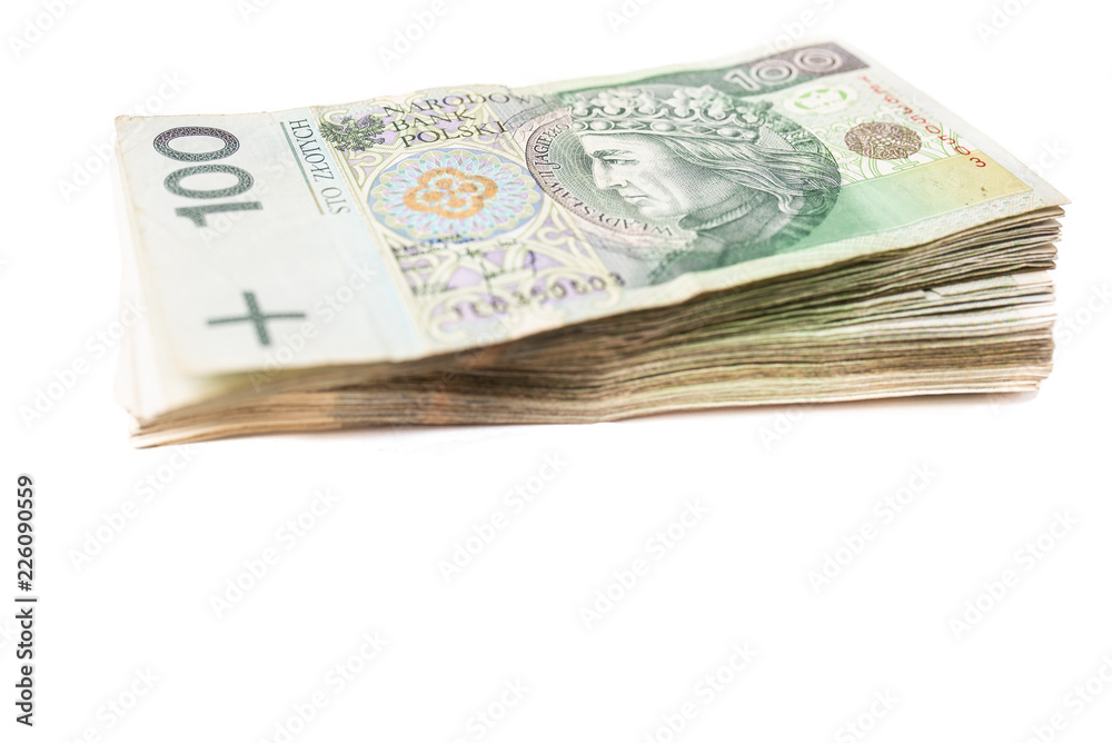 Bundle of banknotes on white isolated background arranged on a pile. Our savings for the future and retirement. Financial freedom by saving money. Collected money Bundle of banknotes on white isolated background arranged on a pile. Our savings for the future and retirement. Financial freedom by saving money. Collected money