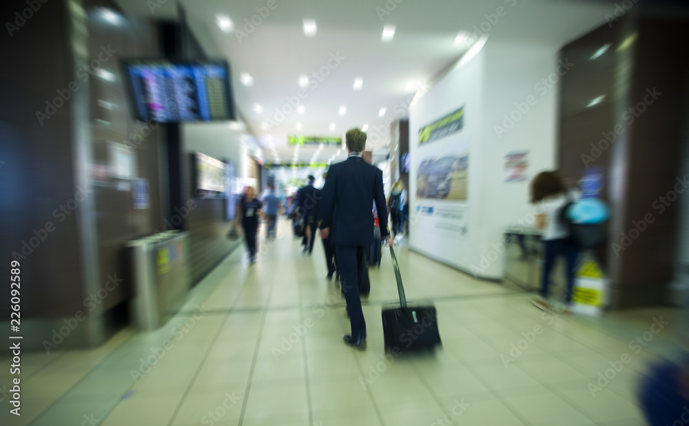 business man rushing to the airport. motion blur image