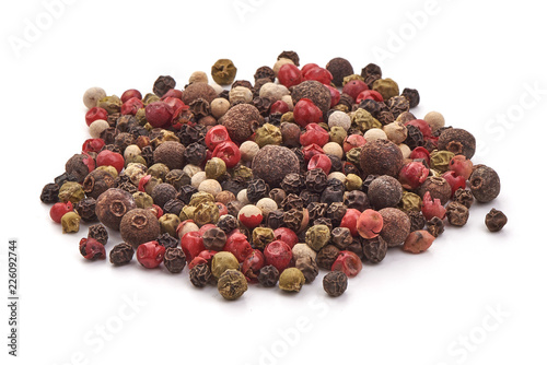Pepper mix. Black, red and white peppercorns, isolated on white background. Close-up.