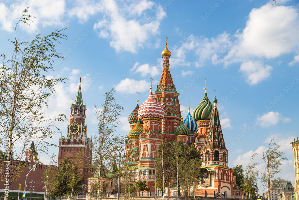 View on Saint Basil Cathedral and Spasskaya tower of Kremlin from Zaryadye park. Famous russian landmarks at autumn.