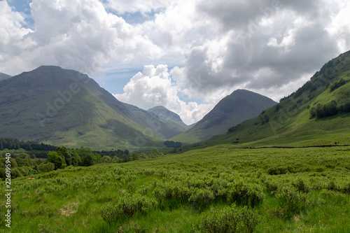 Green hills with mountains and clouds in Scotland © Tristan