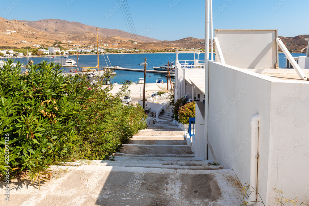 Stairs with view of Livadi bay and port.The island of Serifos. Cyclades, Greece