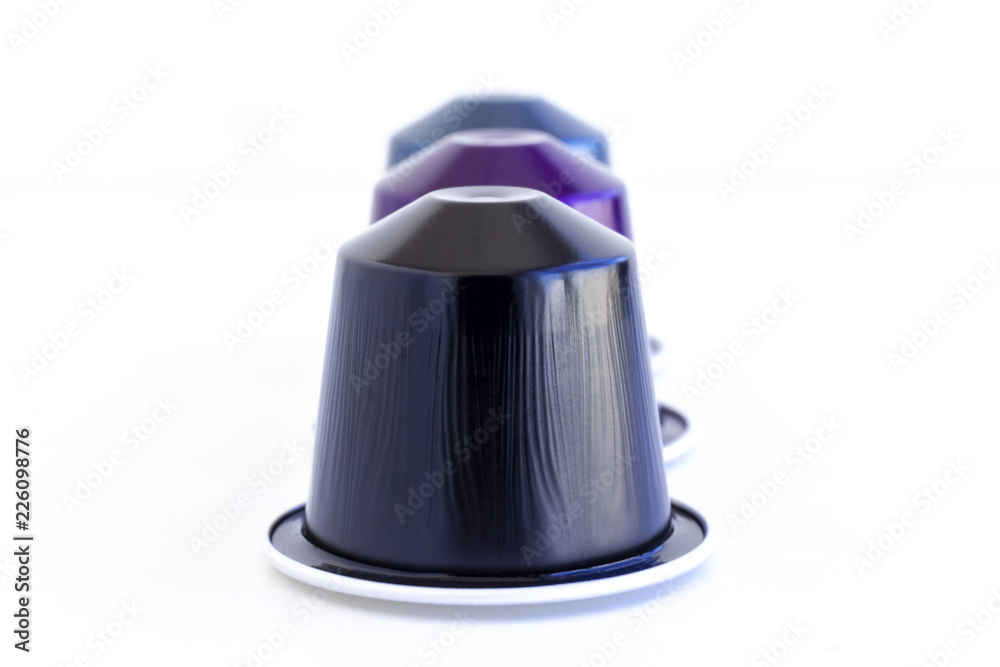 Fototapeta premium Italian coffee espresso capsules or coffee pods on isolated white background. Can be used as an element for your design