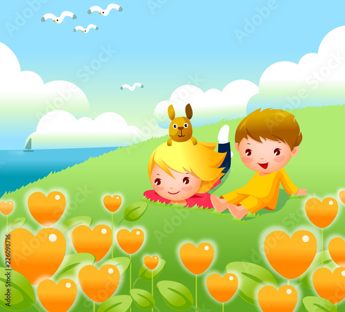 Boy and a girl sitting on the bank of a river