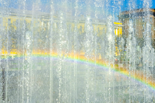 Rainbow on the transparent wall of fountain jets in Saint Petersburg