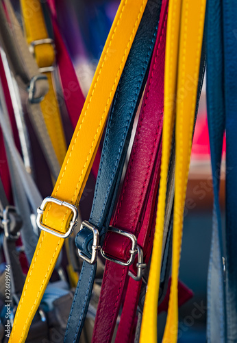 Background from a variety of colored belts closeup.