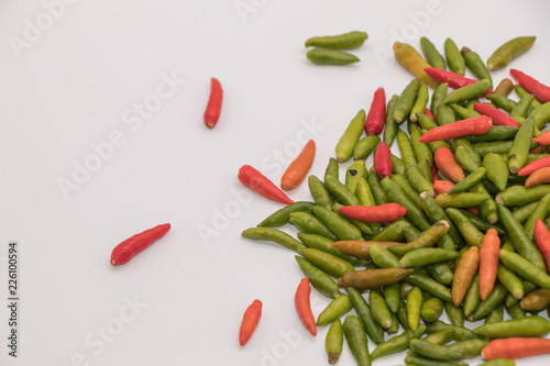 Red and green chilli pepper isolated on white background. common names : Small Chilli Padi, Bird's Eye Chilli in Capsicum annuum Solanaceae family.
