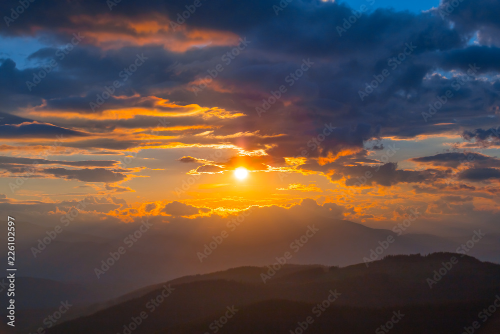 mountain chains under the dramatic sunset