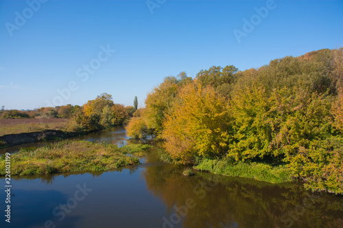 autumn landscape with river and trees