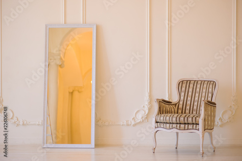 Cozy chair in the photo studio with wedding decoration and flowers bouqet photo