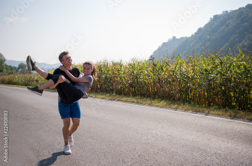 happy couple jogging along a country road © .shock