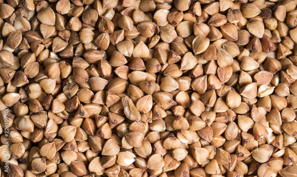 Background, texture, the rump. Buckwheat. Roasted buckwheat. Useful properties of buckwheat. Garnish. Ingredient, product, cook. Brown. Agribusiness, crop, organic farming. Dietary product. Background, texture, the rump. Buckwheat. Roasted buckwheat. Useful properties of buckwheat. Garnish. Ingredient, product, cook. Brown. Agribusiness, crop, organic farming. Dietary product.