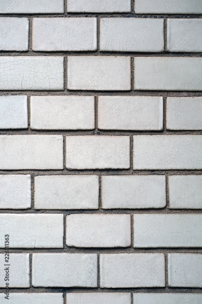 White brick wall texture background. Square white brick wall background. Old white brick wall background texture close-up.