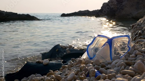 Snorekling gear lying on the beach photo