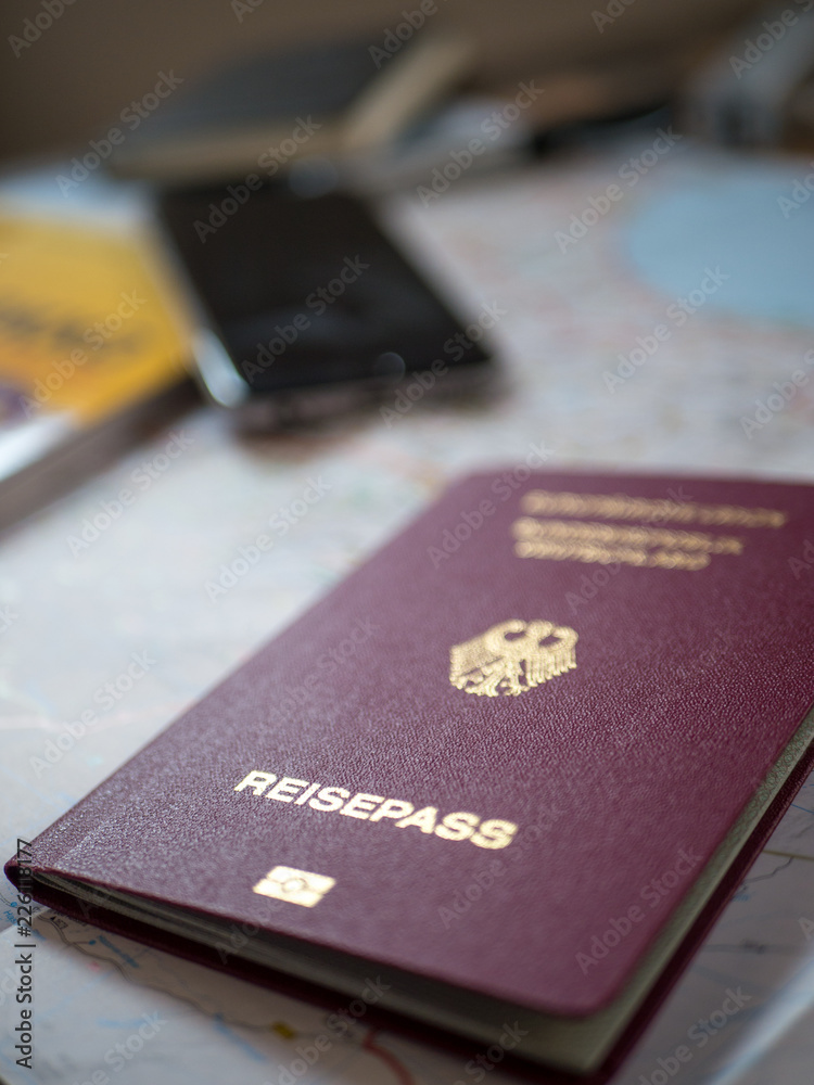 German passport with travel accessories German passport with travel accessories