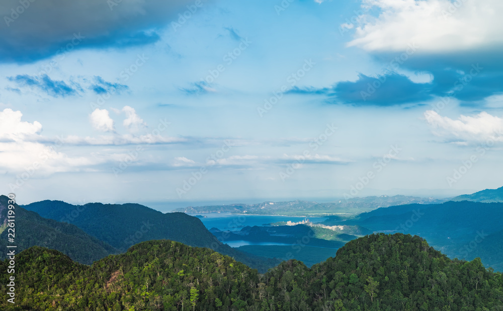 View of blue sky, sea and mountain seen from Cable Car viewpoint, Langkawi, Malaysia. Picturesque landscape with tropical forest, beaches, small Islands in waters of Strait of Malacca